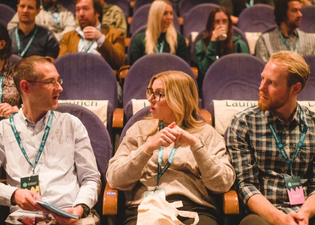 Audience on front row at Launch performance marketing event