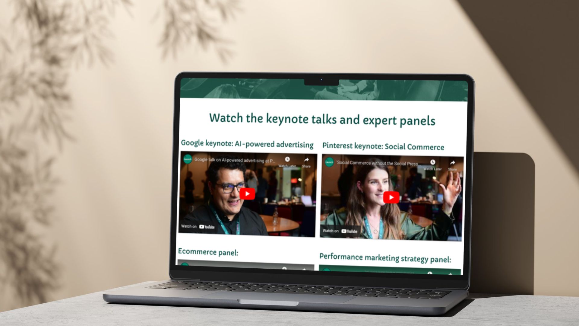 A laptop screen shows some Youtube videos by Google and Pinterest speaking at Launch's peak performance event in 2023